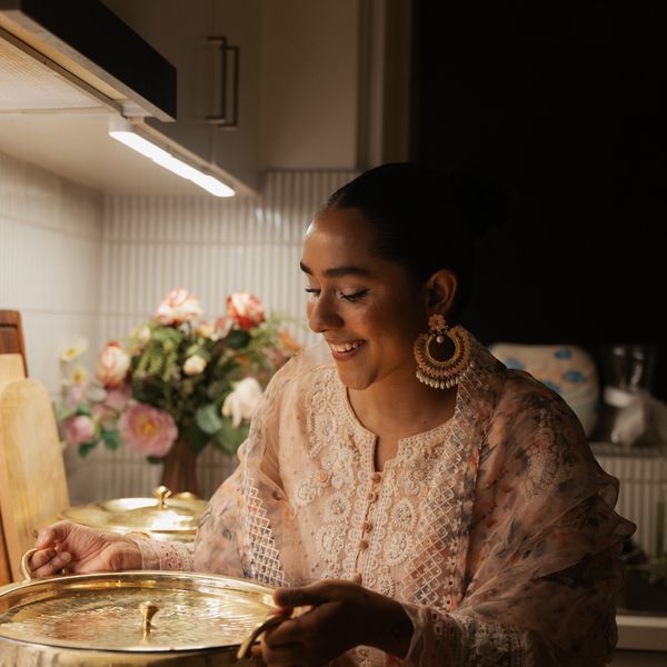 Plating a dish in the kitchen before service