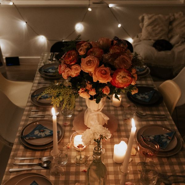 The long table set with florals and candlelight