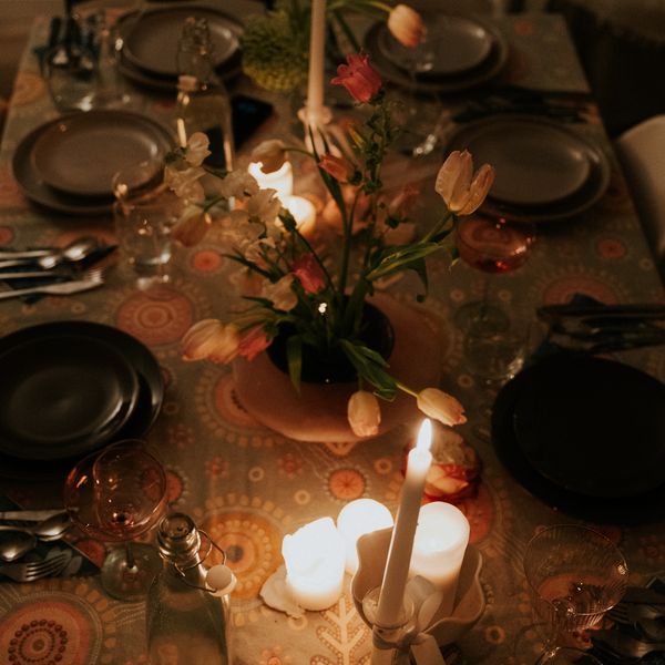 Place settings, candles and flowers down the centre