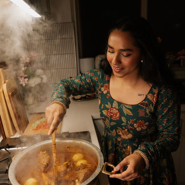 Cooking at the stove mid-service