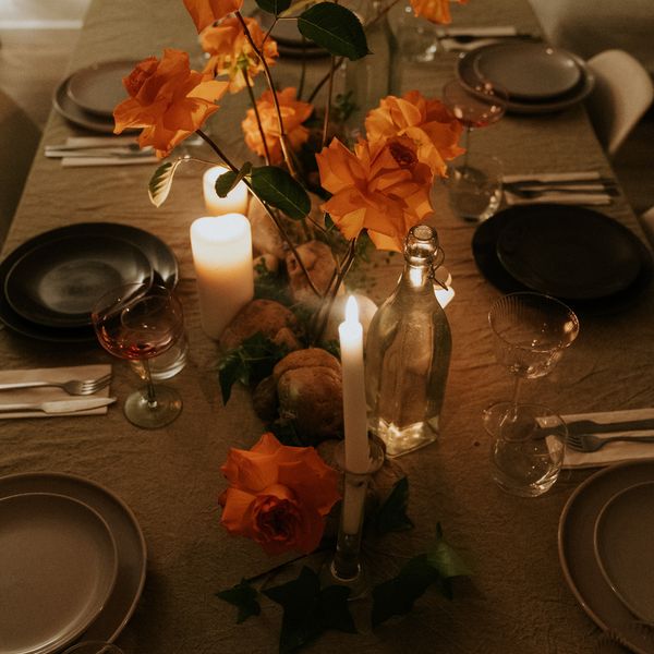 Orange florals and candles down the table